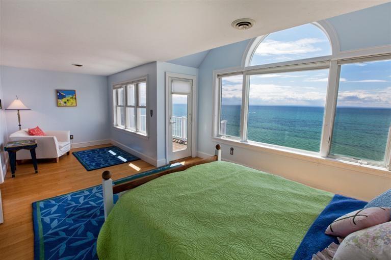64 Corn Hill Road Truro, MA 02666 - Photo 14 of 30 a bed room with furniture and a window
