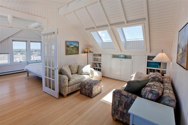 64 Corn Hill Road Truro, MA 02666 - Photo 25 of 30 a living room with furniture and a wooden floor