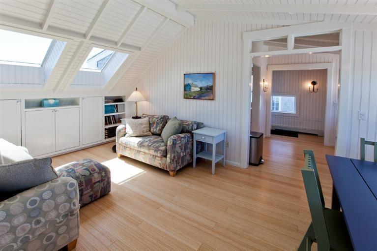 64 Corn Hill Road Truro, MA 02666 - Photo 26 of 30 a living room with furniture and a wooden floor