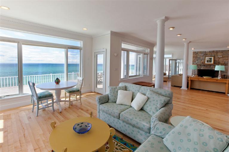 64 Corn Hill Road Truro, MA 02666 - Photo 6 of 30 a living room with furniture and a table