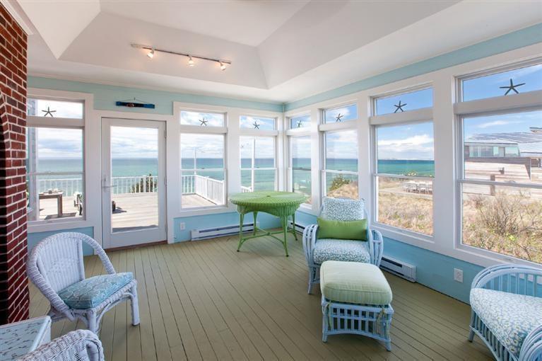 64 Corn Hill Road Truro, MA 02666 - Photo 8 of 30 a living room with furniture and a large window