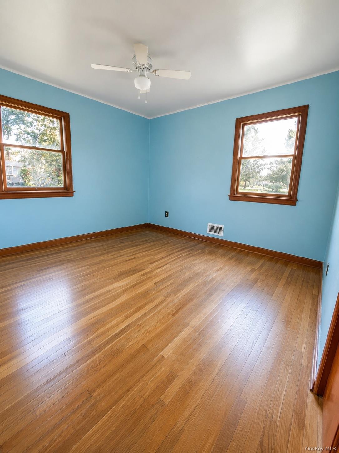 16 Clay Pitts Road Greenlawn, NY 11740 - Photo 12 of 25 Primary bedroom with hardwood flooring.