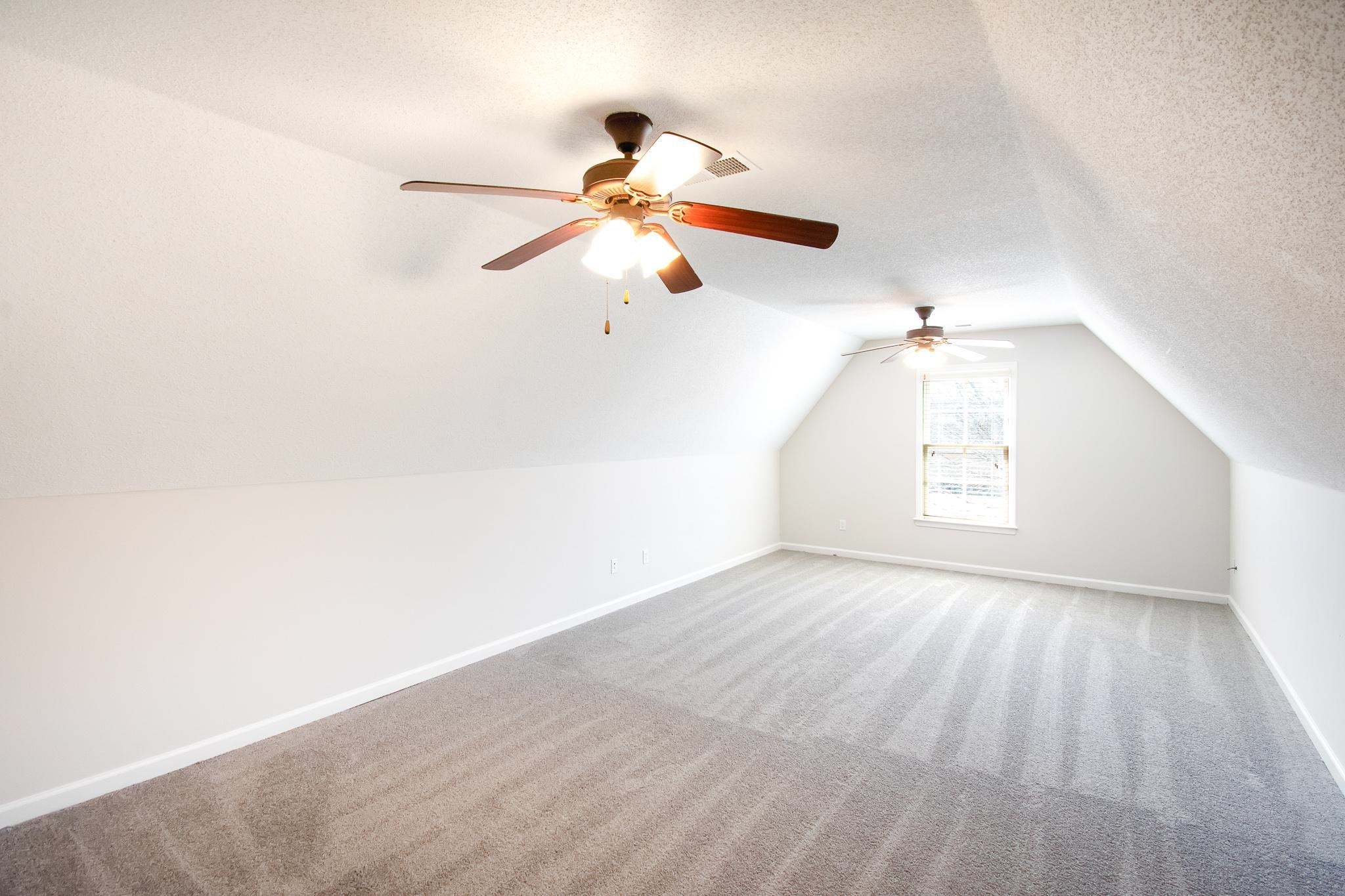 6024 Maher Trail Bartlett, TN 38135 - Photo 20 of 25 a view of a room with a window and a ceiling fan