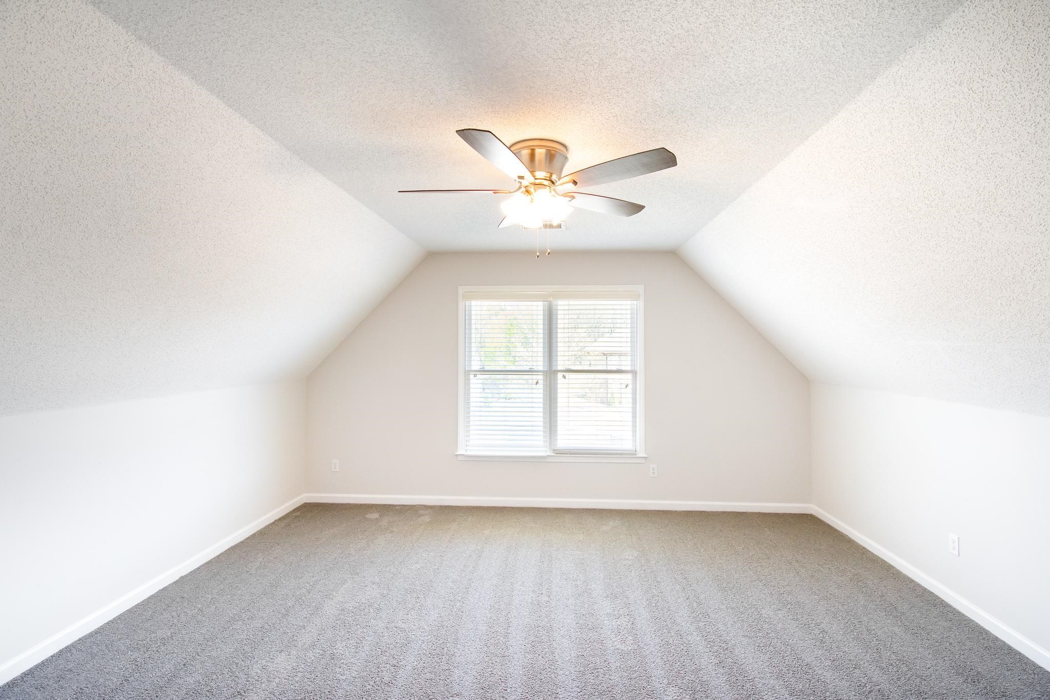 6024 Maher Trail Bartlett, TN 38135 - Photo 21 of 25 an empty room with a window and a fan