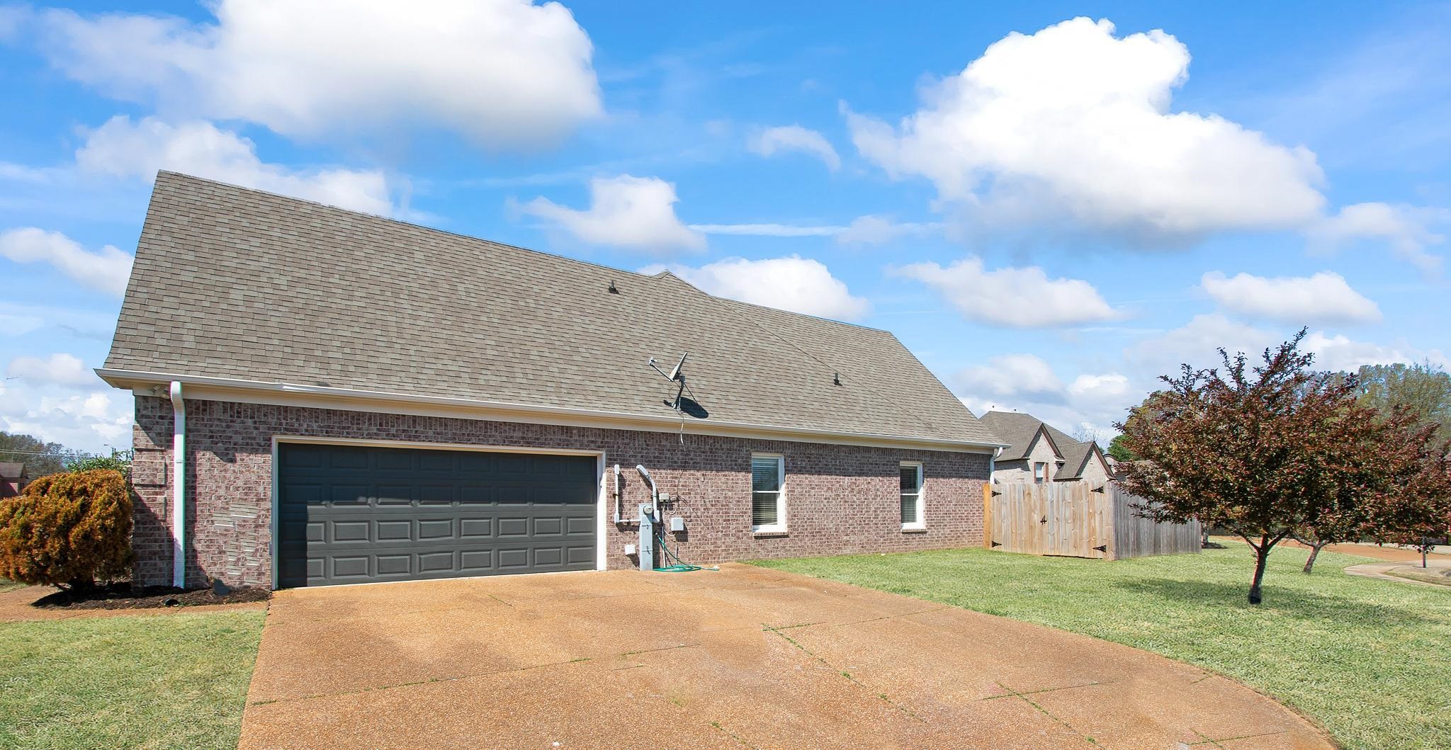 6024 Maher Trail Bartlett, TN 38135 - Photo 5 of 25 a front view of a house with a yard