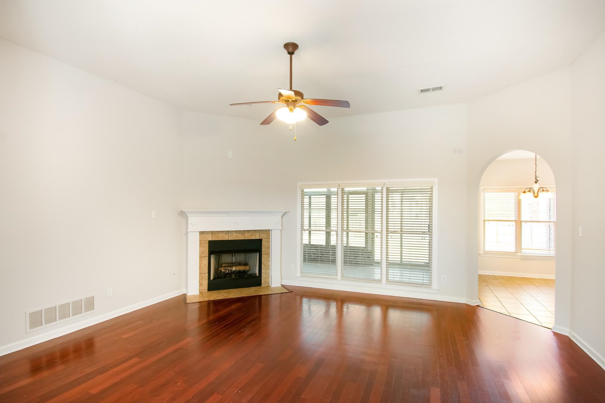 6024 Maher Trail Bartlett, TN 38135 - Photo 8 of 25 wooden floor in an empty room with a window