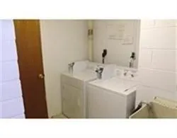 a bathroom with a sink a mirror and a toilet