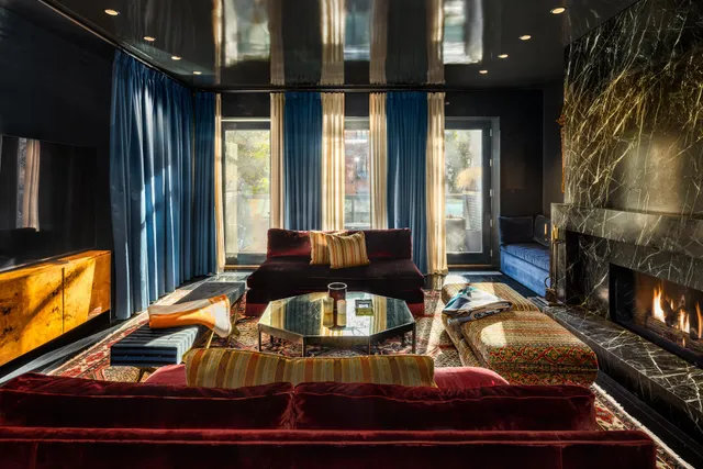 a living room with furniture pool table and flat screen tv