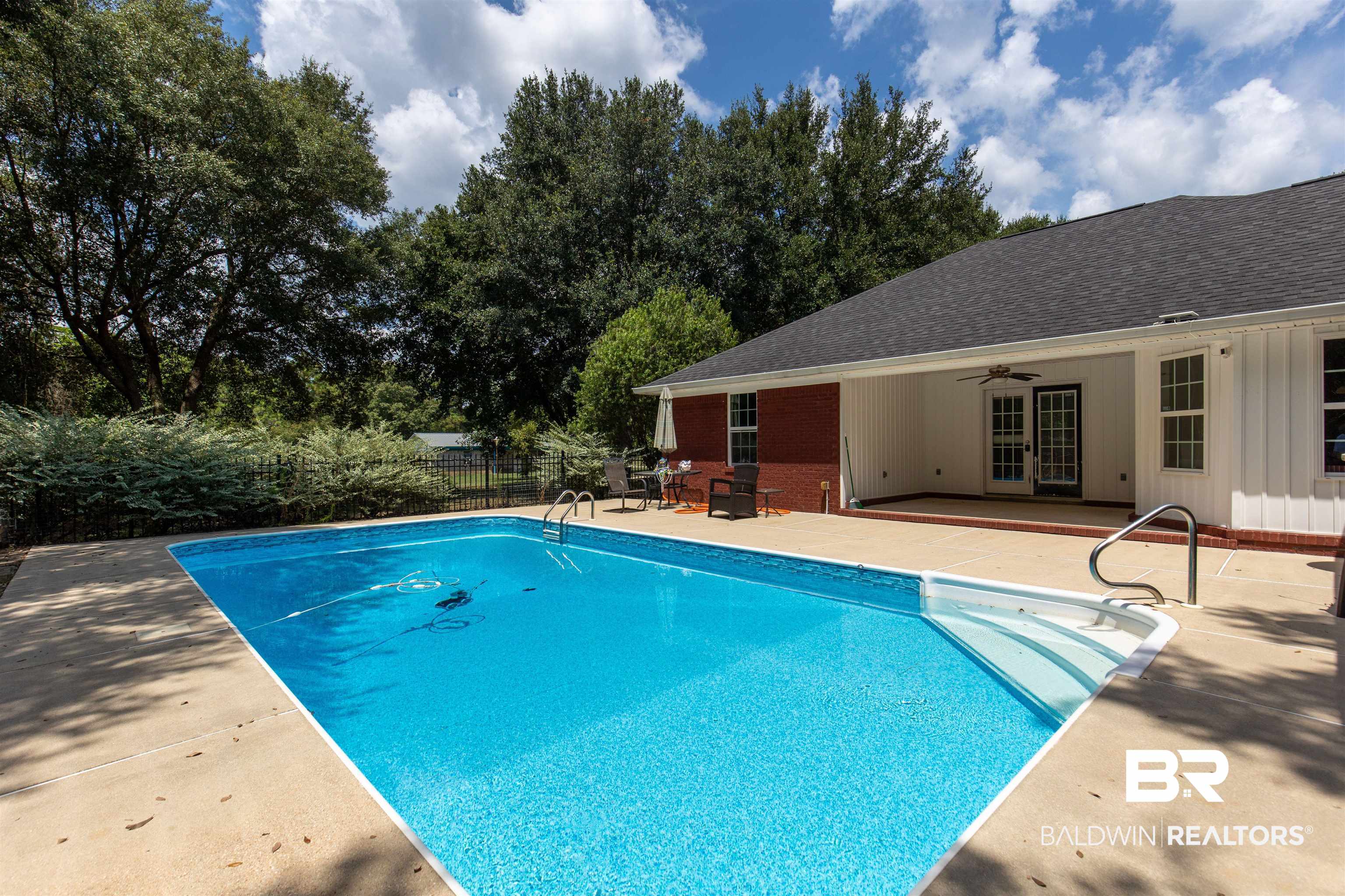 36087 Byrd Road Stapleton, AL 36578 - Photo 4 of 27 View of swimming pool with ceiling fan, a patio area, and french doors