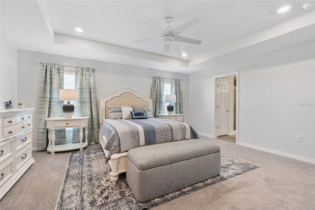 a bedroom with furniture and windows