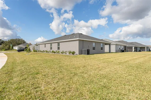 a view of an house with swimming pool outdoor seating