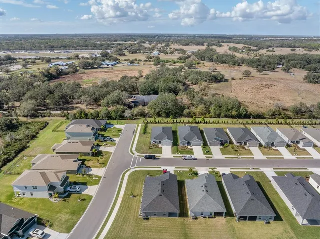 an aerial view of a house with a ocean view