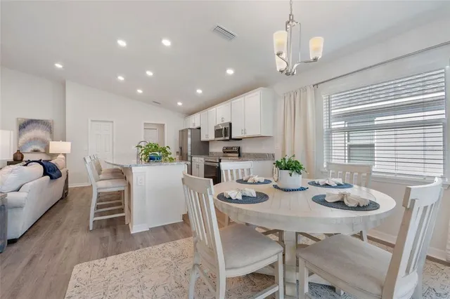 a view of a dining room with furniture