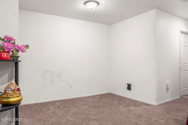 a view of room with wooden floor and shelf