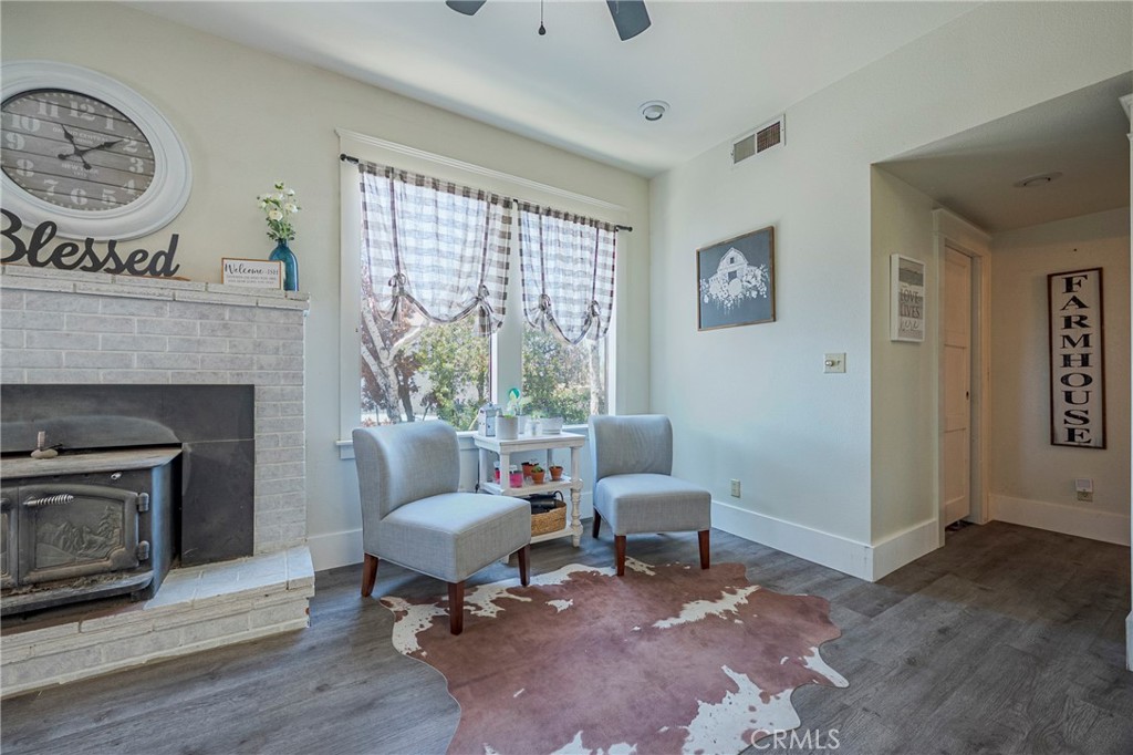 14625 Le Grand Road Le Grand, CA 95333 - Photo 35 of 60 a living room with furniture a window and a fireplace