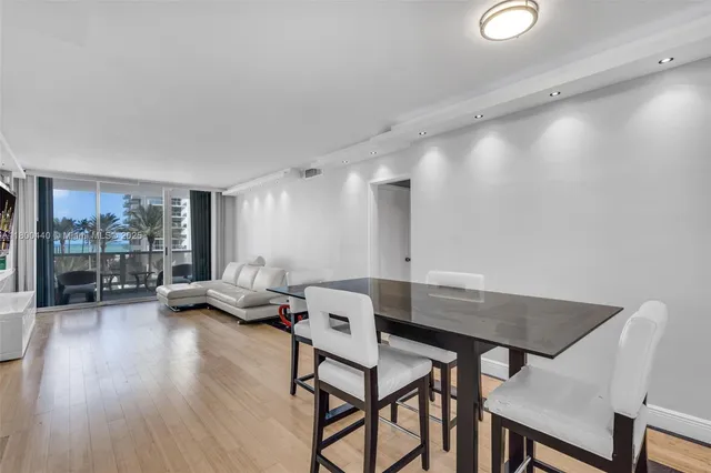 a view of a livingroom with furniture and a large window
