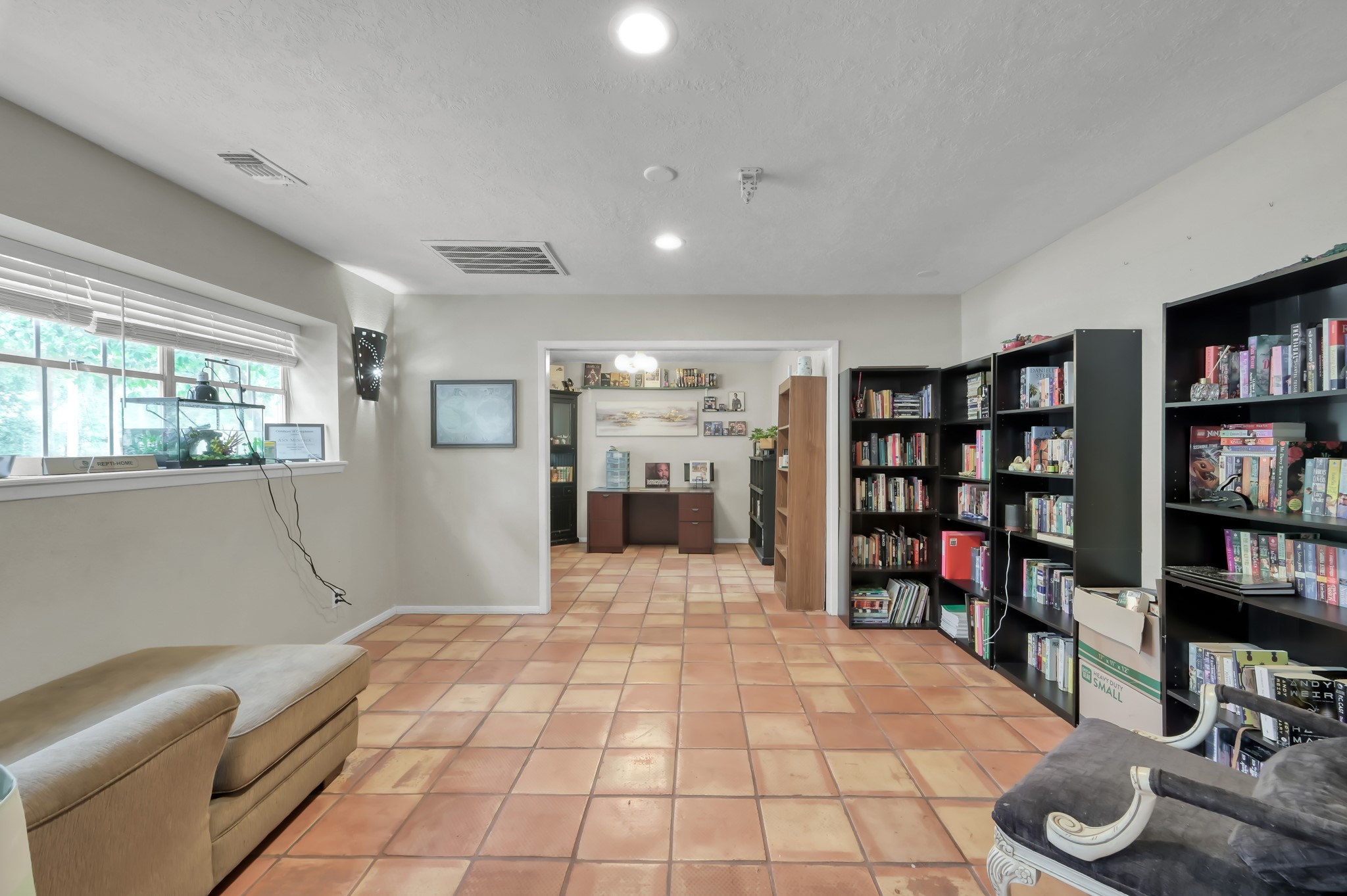 25610 Walnut Grove Circle Spring, TX 77380 - Photo 5 of 29 a room with lots of furniture and a book shelf