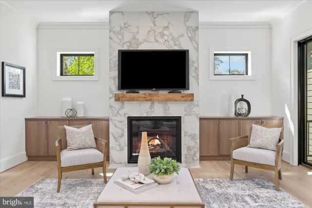a view of room with window and wooden floor