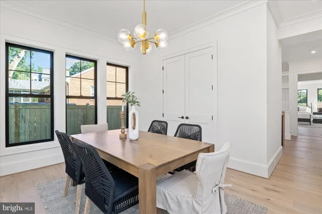 a spacious bedroom with a bed and a painting on the wall
