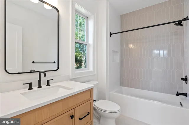 a front view of a house with a yard and table and chairs