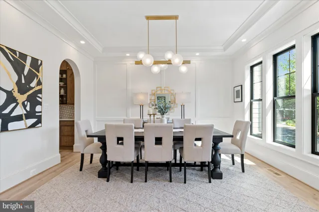 a kitchen with stainless steel appliances kitchen island wooden cabinets and entryway