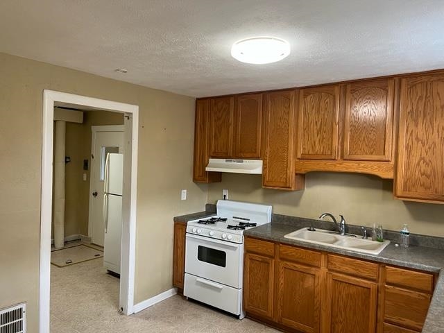 2122 Rivington Road Loves Park, IL 61111 - Photo 7 of 15 a kitchen with a sink cabinets and appliances