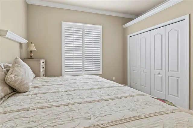 a large white bed in a white room