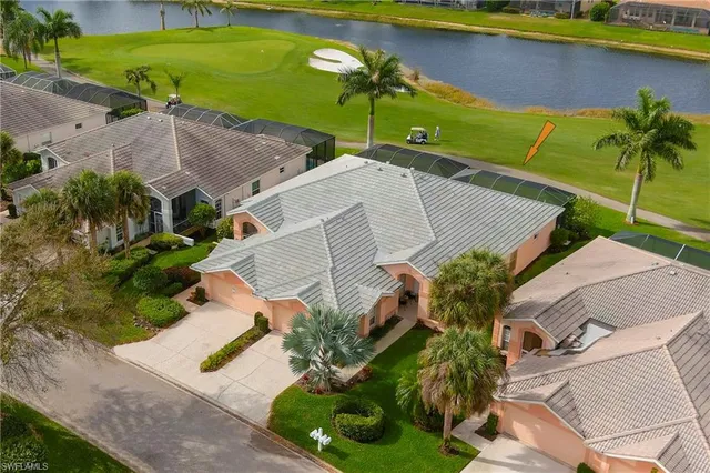 an aerial view of a house with a garden and swimming pool