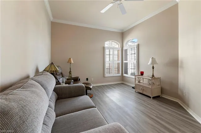 a living room with furniture and windows