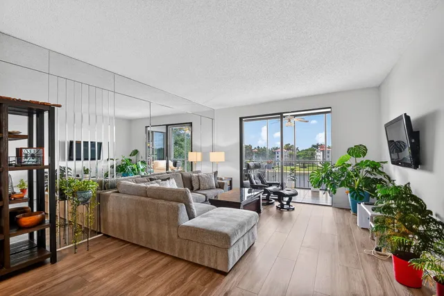 a bedroom with a bed and a flat tv screen