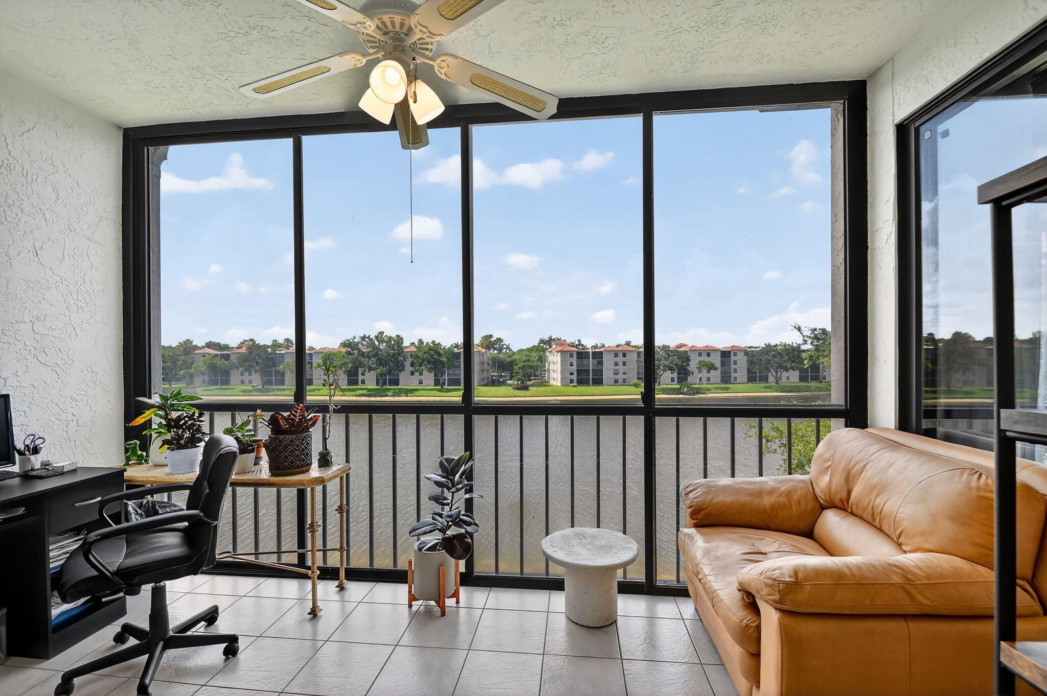 6193 Pointe Regal Circle, Unit 402 Delray Beach, FL 33484 - Photo 18 of 104 a balcony with furniture