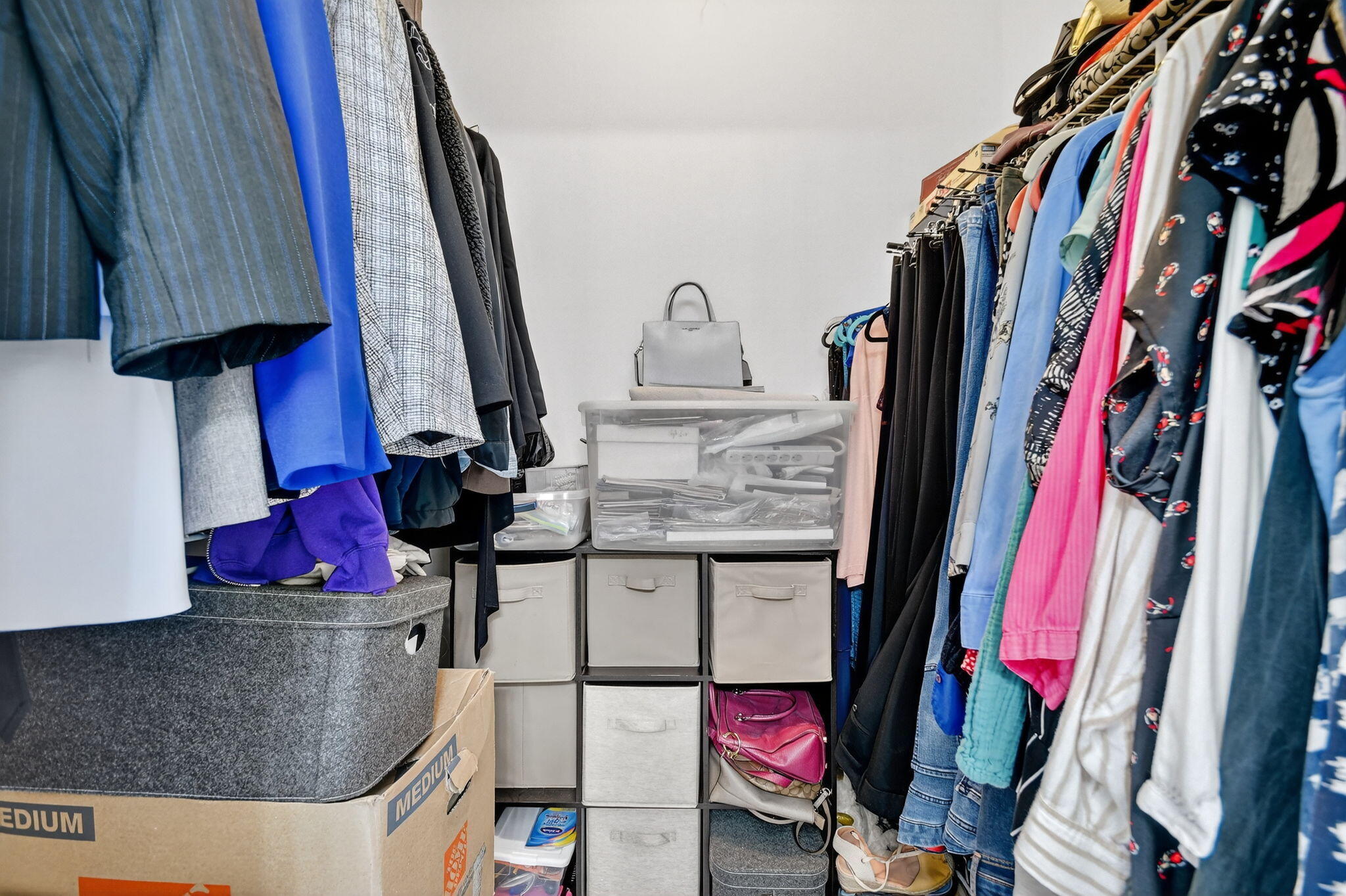 6193 Pointe Regal Circle, Unit 402 Delray Beach, FL 33484 - Photo 27 of 104 a view of walk in closet with clothes and shoes