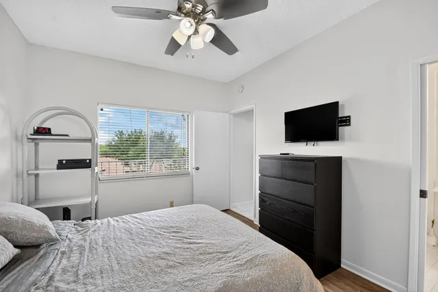 a view of swimming pool with a lounge chairs