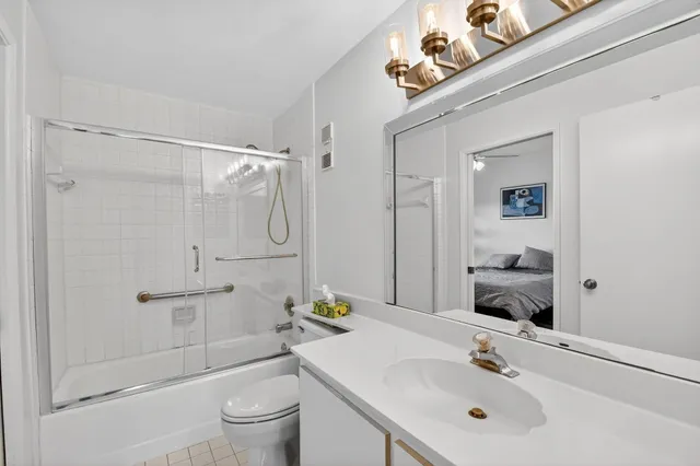 a kitchen with a sink and a dishwasher with wooden floor