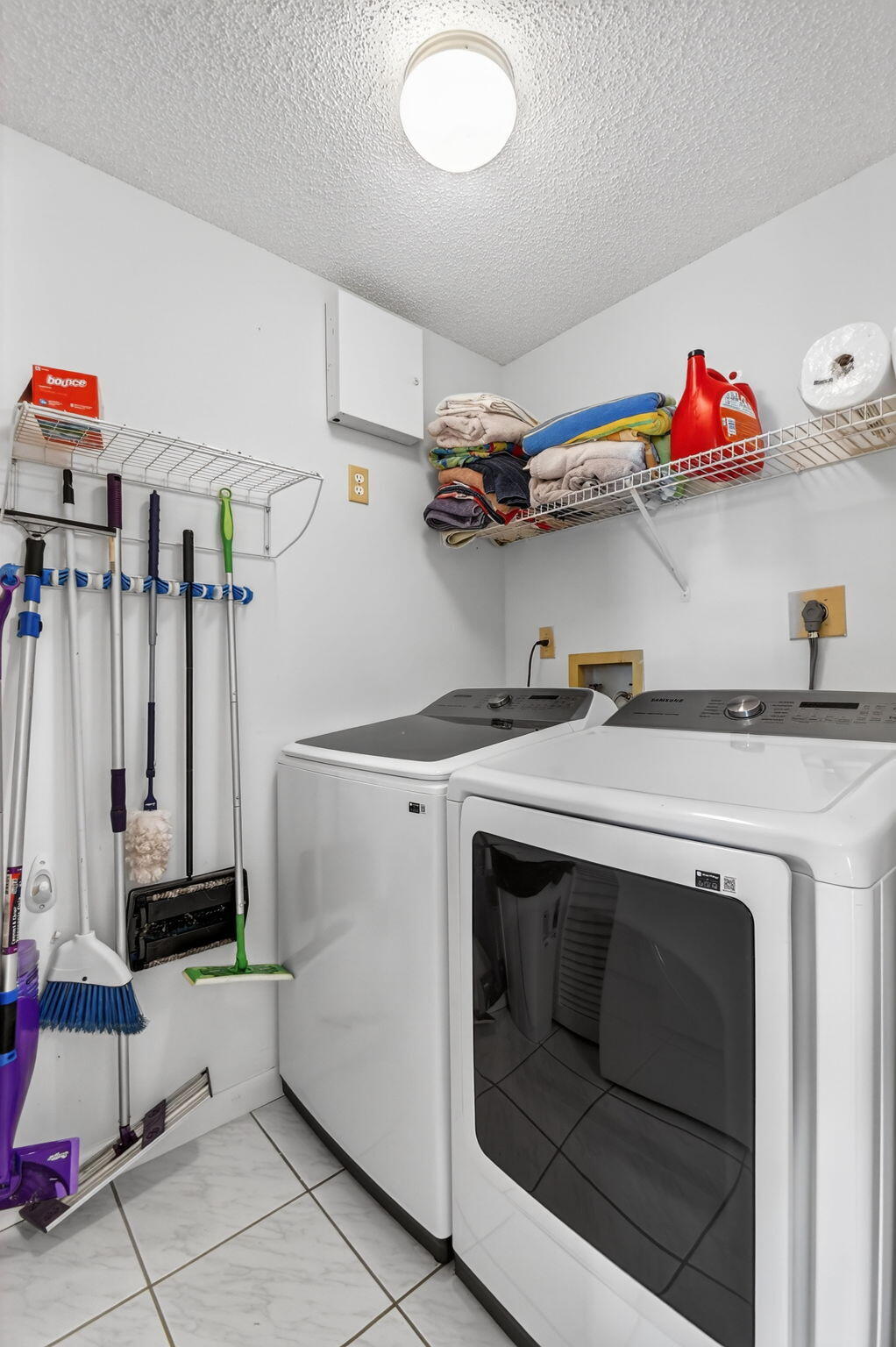 6193 Pointe Regal Circle, Unit 402 Delray Beach, FL 33484 - Photo 32 of 104 a utility room with dryer and washer
