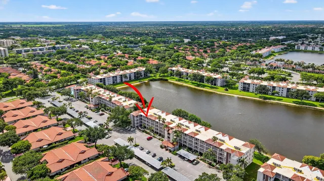 a view of a livingroom with furniture and a large window
