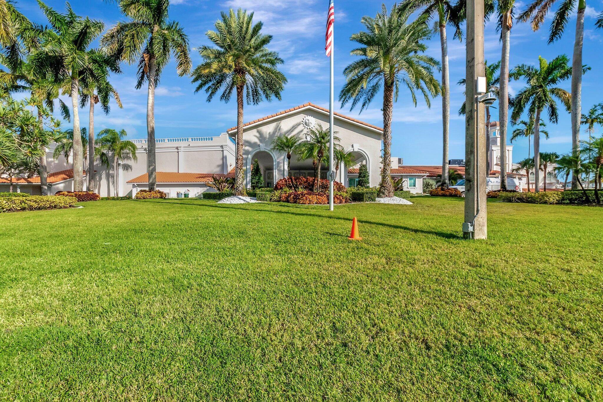 6193 Pointe Regal Circle, Unit 402 Delray Beach, FL 33484 - Photo 65 of 104 a view of a park with palm trees