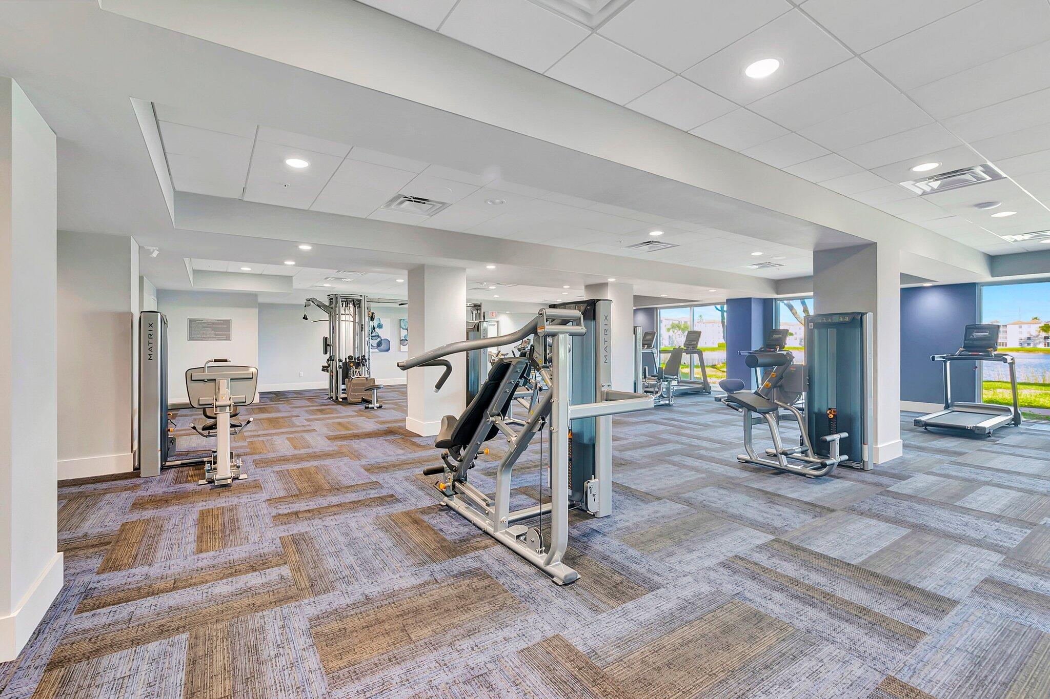6193 Pointe Regal Circle, Unit 402 Delray Beach, FL 33484 - Photo 87 of 104 a view of a room with gym equipment