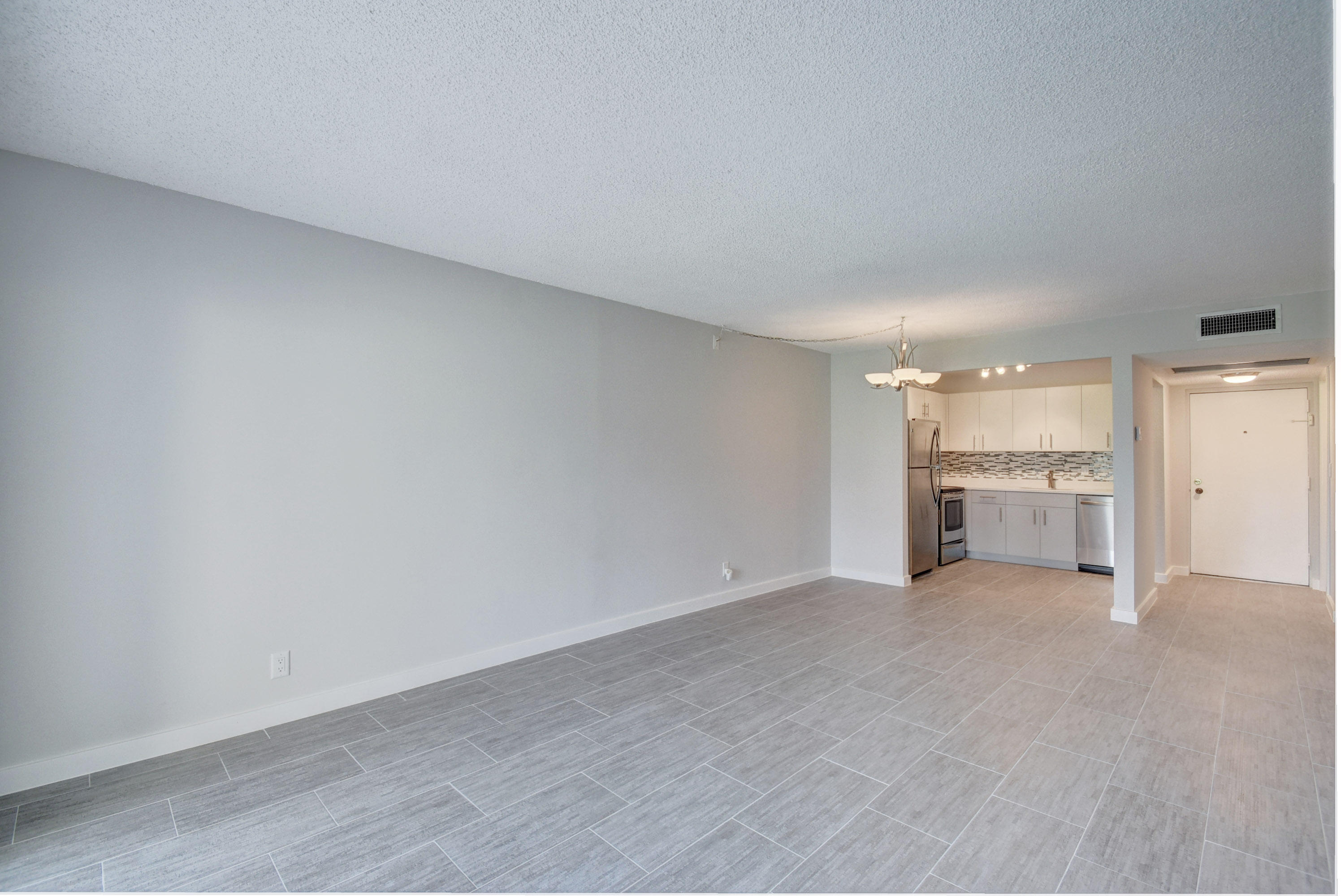 9355 Southwest 8th Street, Unit 120 Boca Raton, FL 33428 - Photo 5 of 21 Living Room/Kitchen/Foyer