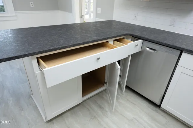 a utility room with washer and dryer