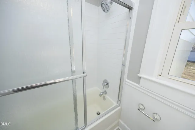 a view of a bathroom from the hallway