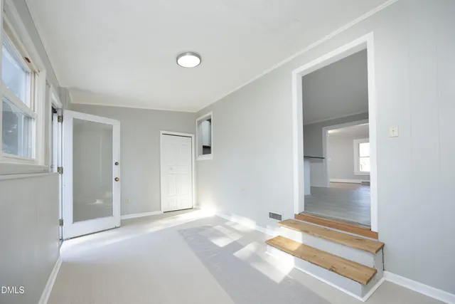 an empty room with windows