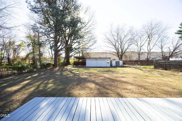 a view of a house with pool and sitting area