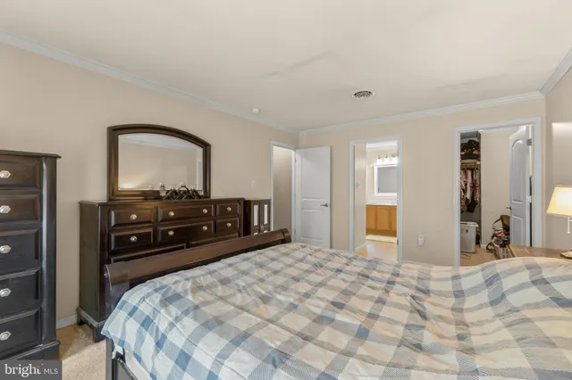 a bed room with a bed and a television