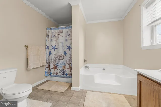 a bathroom with a bathtub and shower