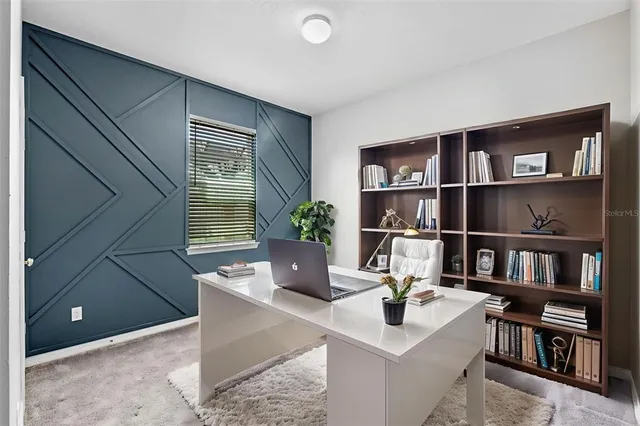 a view of a workspace with furniture