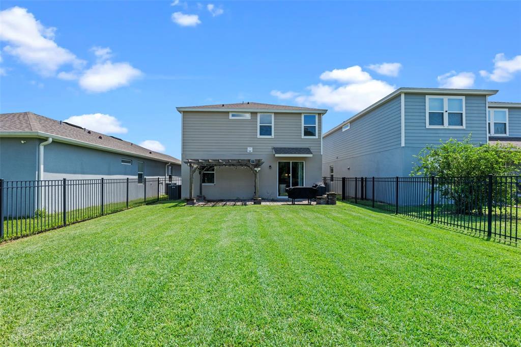 5164 Chickadee Street St. Cloud, FL 34771 - Photo 25 of 35 a view of a yard in front of a house
