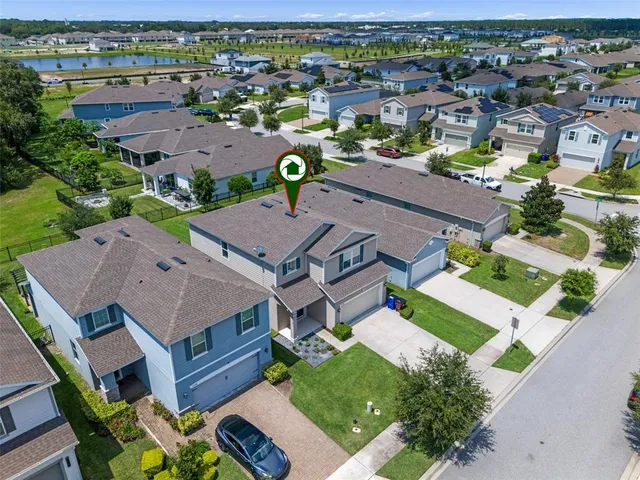 an aerial view of a house with a garden