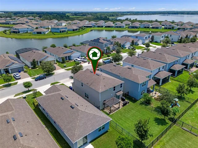an aerial view of a house with a swimming pool