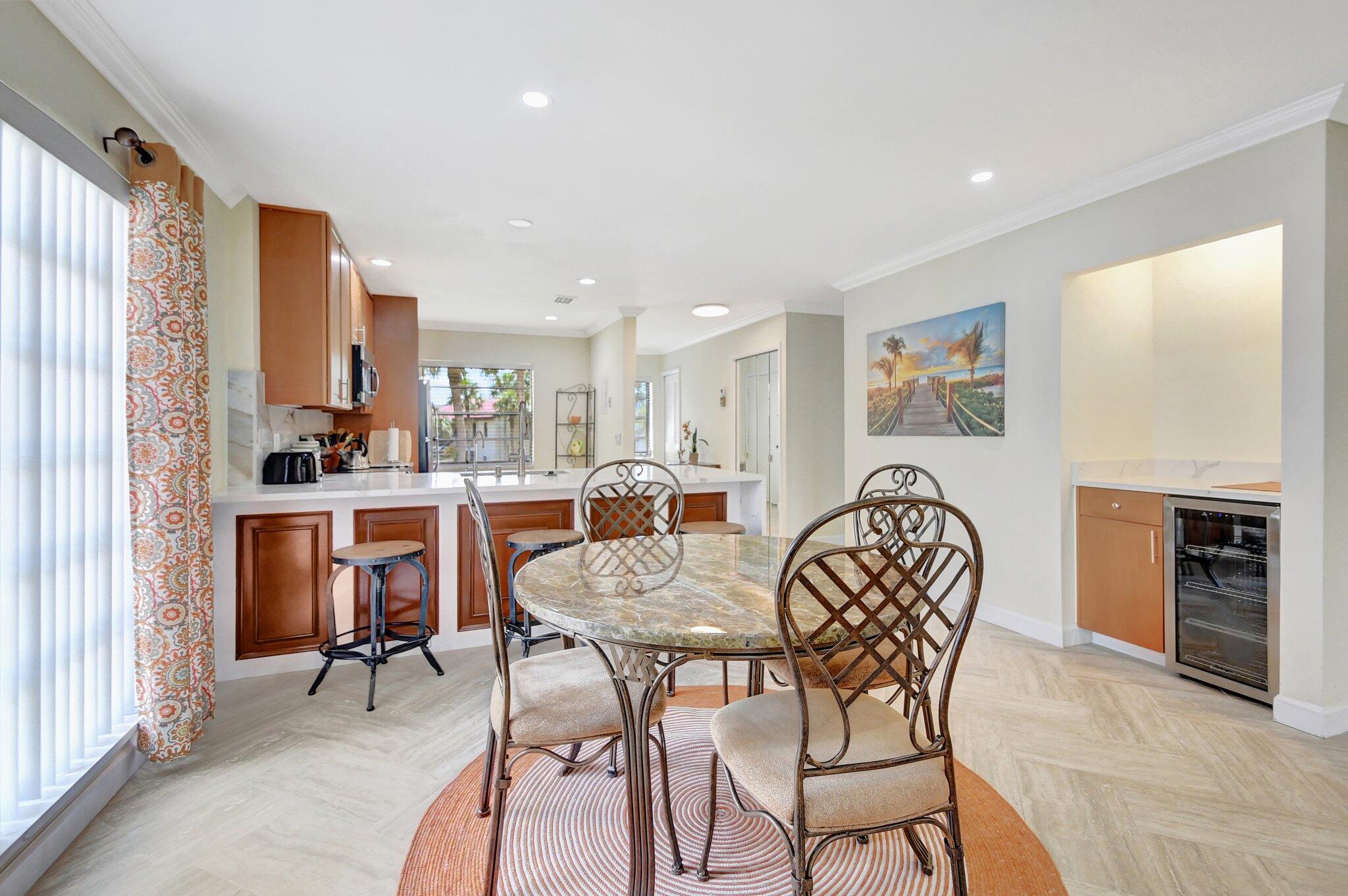 21209 Lago Circle, Unit 12G Boca Raton, FL 33433 - Photo 15 of 39 a dining room with furniture and window